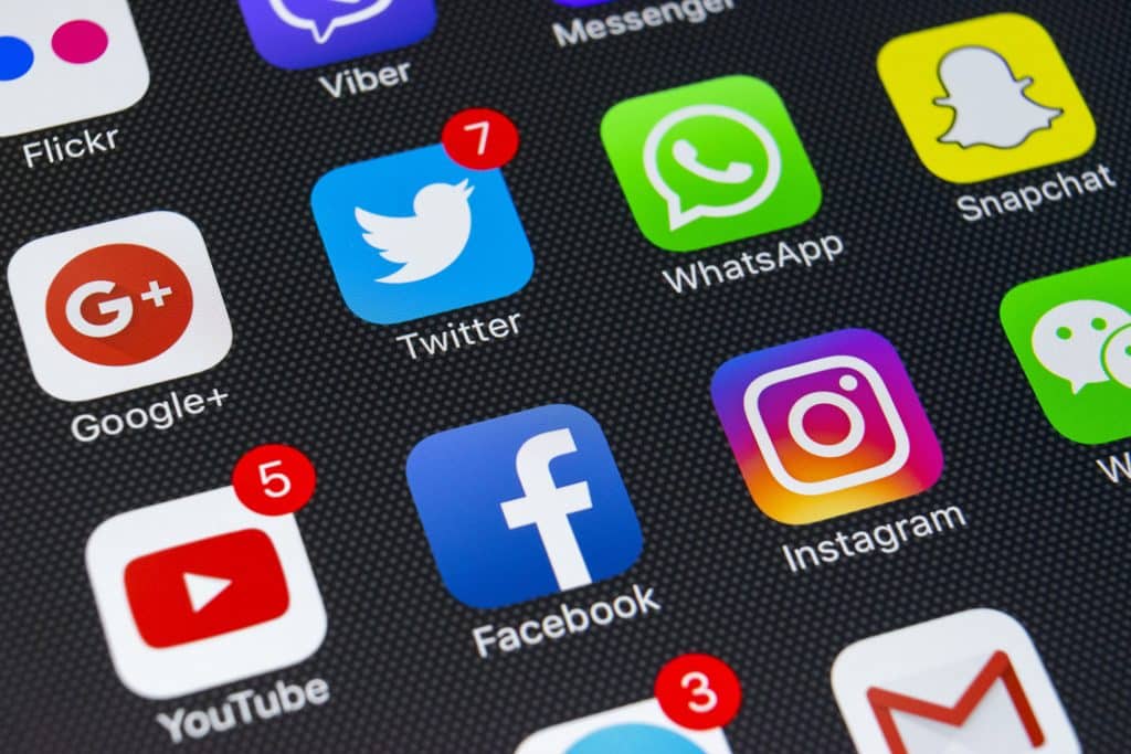 Sankt-Petersburg, Russia, February 25, 2018: Apple iPhone X with icons of social media facebook, instagram, twitter, snapchat application on screen. Social media icons. Social network