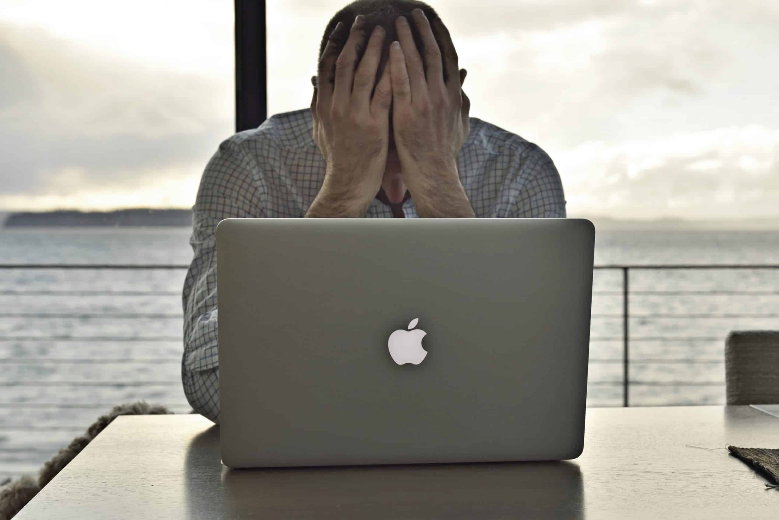 man-sitting-at-computer