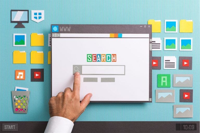 papercraft desktop with hand